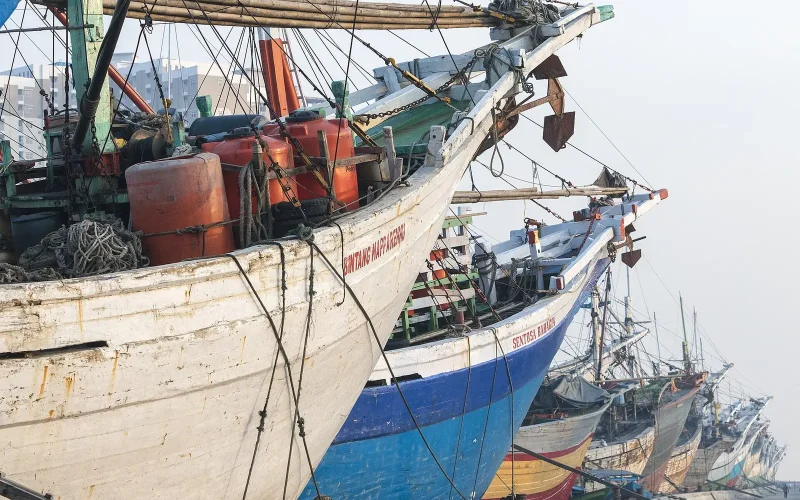 A Bugis wooden phinisi working cargo at Sunda Kelapa harbour, Jakarta